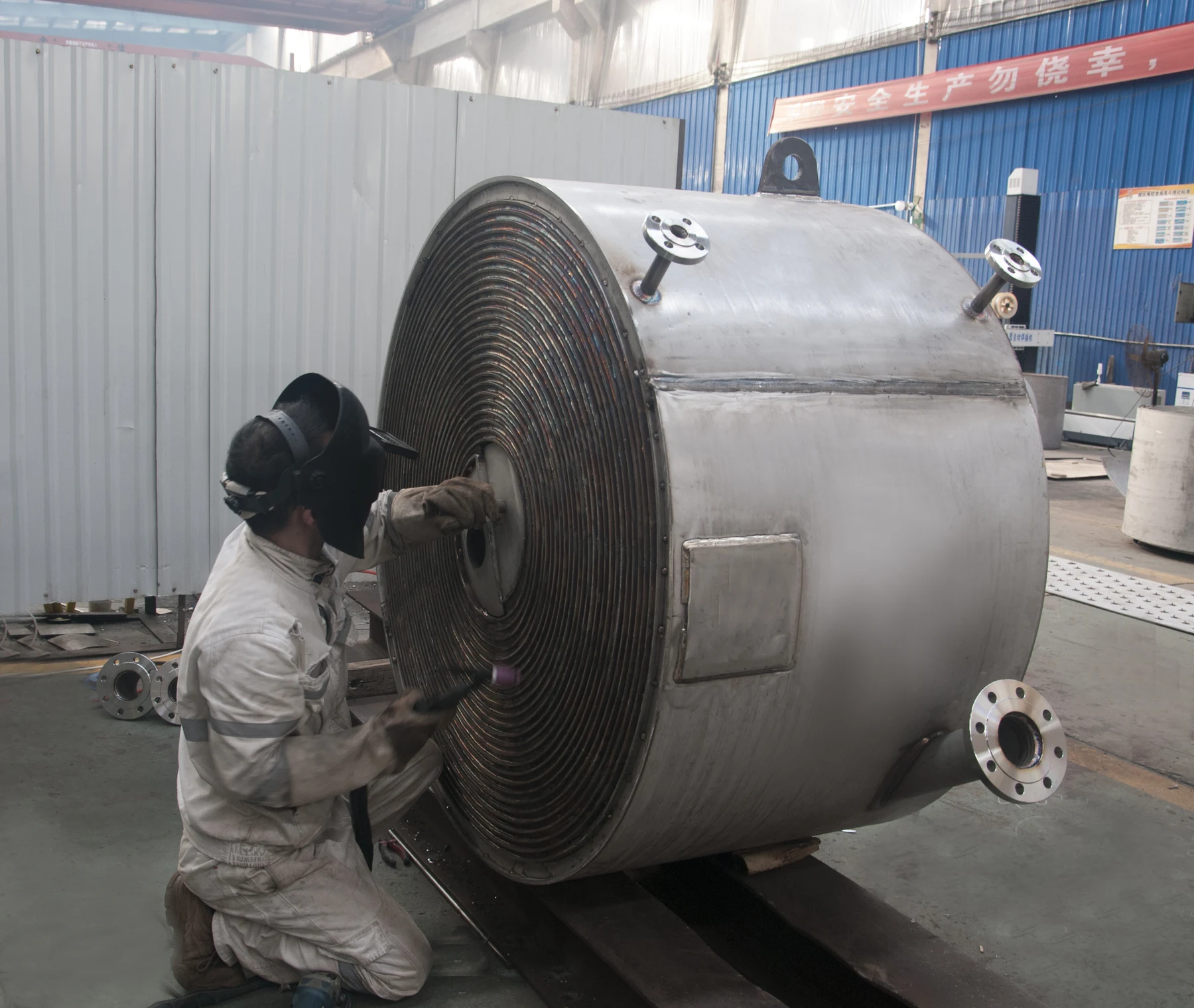 HEXNOVAS welder finishing a spiral heat exchanger core