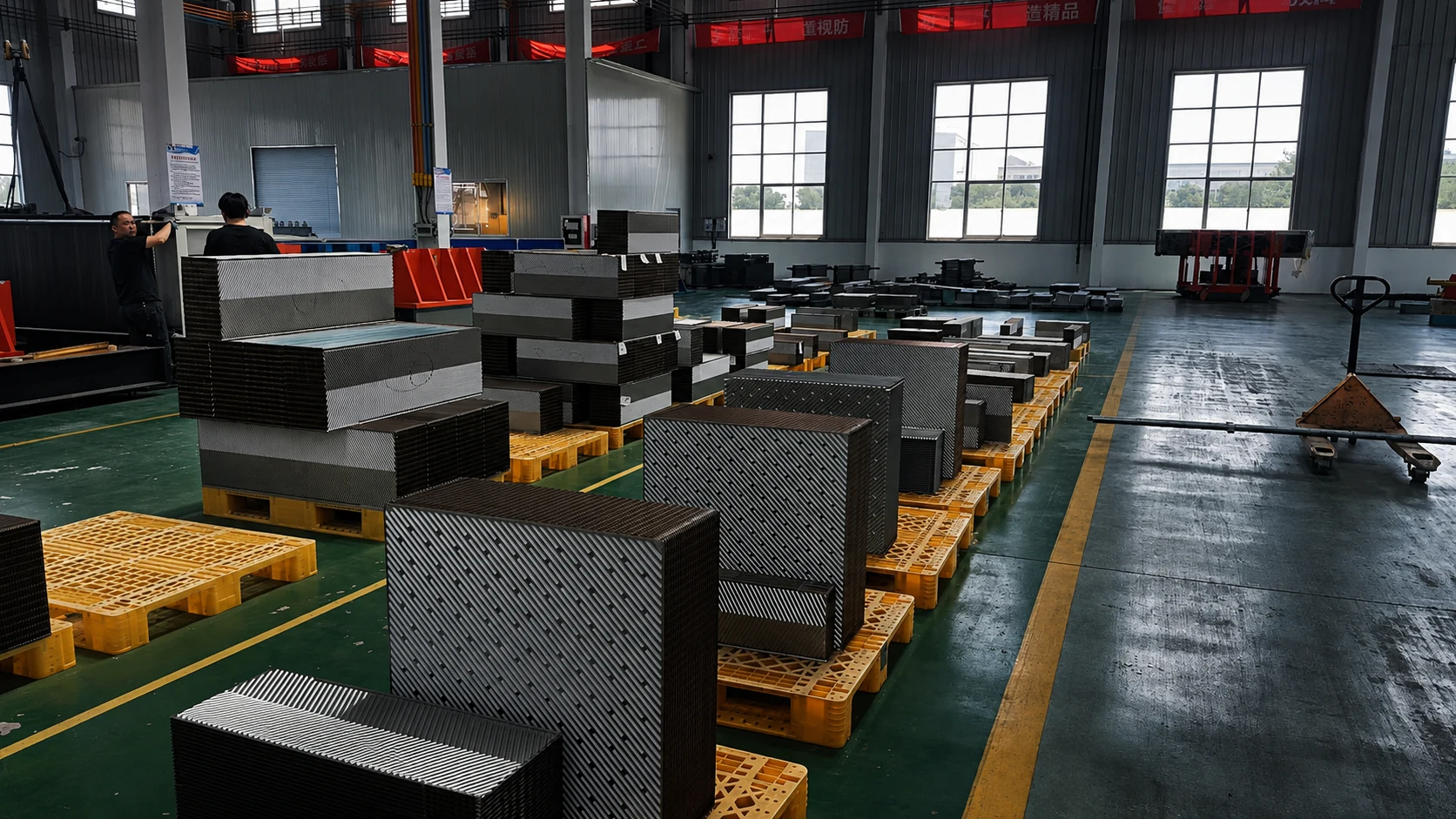 Welded Compabloc plate packs staged on pallets during production